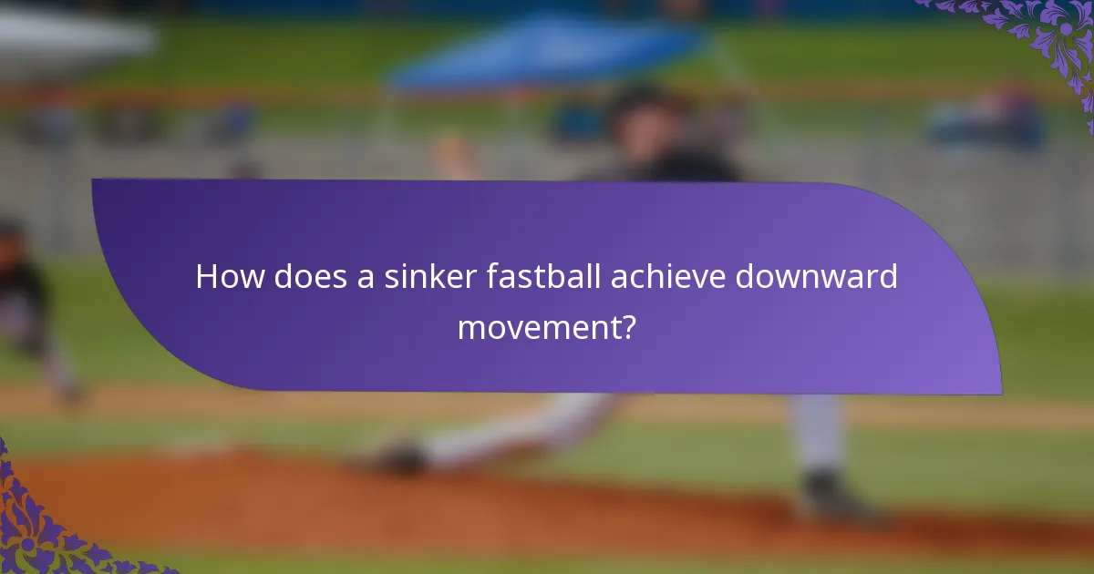 How does a sinker fastball achieve downward movement?